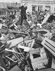 Photograph of Deputy Sheriff Destroying 500 Confiscated Gaming Machines in Yard at Bridewell Prison, Chicago