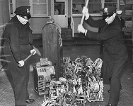Photograph of Security Guards Smashing Confiscated Gaming Machines near Elliott Bay