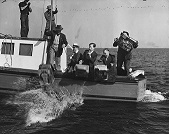 Photograph of Officers Throwing Confiscated Gaming Machines Overboard the S.S. Rex